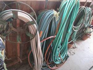 lot 111 image: Assortment of garden hoses in various sizes