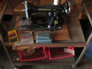 lot 140 image: Vintage Universal Sewing Machine on portable 2-tier cart with stackable storage Bins