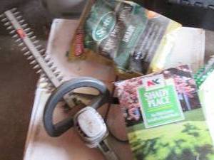 lot 157 image: Electric hedge Trimmer, new2lb bag of Scotts pure premium shady grass seed and other seed