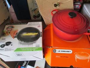 lot 175 image: Le Creuset 2.4L cherry red oven casserole pan in original box with worlds greatest cooking pot in original box