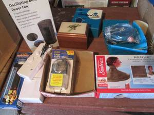 lot 190 image: Mini oscillating tower fan, clothes line reels, heat therapy and other home supplies