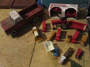 lot 214 image: Vintage Metal pick up truck, New in box International Mini-tractor & wagon along with an assortment of other toy cars and farm equipment