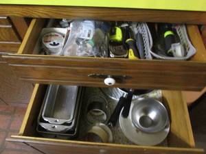 lot 222 image: Kitchen drawers full of baking pans and supplies along with a drawers of assorted hand tools, Keychains, assorted mini-collectibles and more