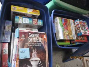 lot 55 image: (2) Covered Storage Totes filled with a nice assortment of jigsaw puzzles in a variety of difficulty levels. (If any pieced were to be missing, it seems to be noted)
