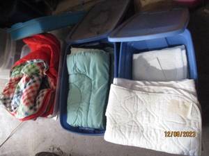 lot 65 image: (3) Lidded Storage Totes filled with a variety of quilts, comforters and other bedding