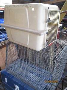 lot 68 image: Smaller plastic portable pet Taxi and mid-large size metal pet containment crate