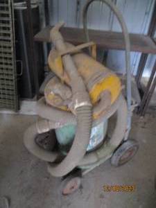 lot 73 image: Antique Metal Happy Horse shop vac style cleaner on its own portable cart