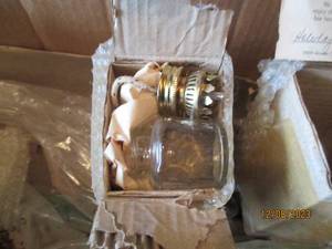 lot 161 image: Glass oil lamps and floral decor