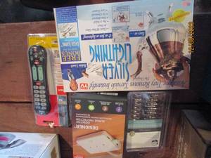 lot 189 image: Silver lining tarnish remover, universal remote, surge protector and shower curtain hooks