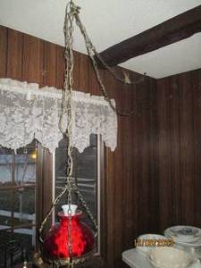 lot 234 image: Vintage hanging plug-in oil-looking pendulum style lamp