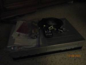 lot 245 image: RCA DVDVHS with cords and remote