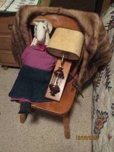 lot 260 image: Real fur womens shoulder covering style shawl and Country feel decor plus wood chair