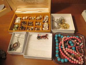 lot 263 image: Velour lined jewelry container with costume jewel necklaces, earrings and broaches.