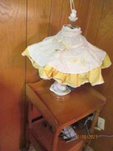 lot 274 image: Uniquely designed vintage end table with lower shelf and drawer plus vintage water pitcher and basin designed table lamp and cordless phone