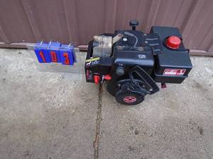 lot 103 image: Snow King 8 hp motor. Good used condition. Tested & works. As shown.