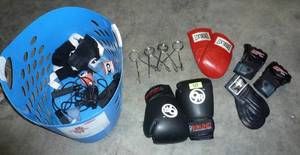 lot 69 image: Lot of kickboxingboxing gloves, strength trainers, wraps, all in a basket