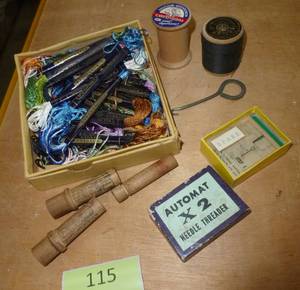 lot 115 image: Lot of embroidery thread and needle holders and a needle threader