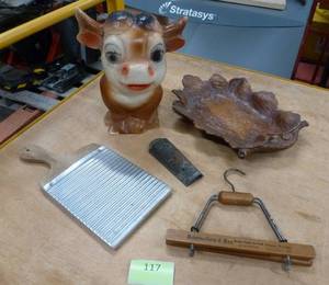 lot 117 image: vintage lot of  a plaster cow bank, mini washboard, pant hanger from 1903