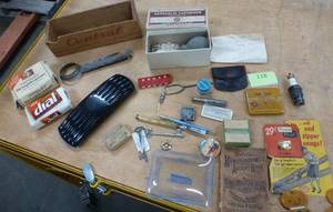 lot 118 image: vintage lot of items including a vaporizer, zipper, One a Day vitamin box and old account book