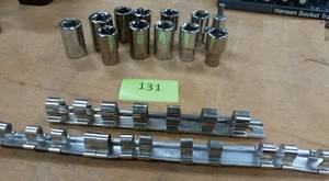 lot 131 image: group of 12 in SAE and metric sockets and a couple holders