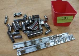 lot 132 image: group of 14 in sockets, holders