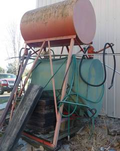 lot 228 image: 2 fuel tanks, top one is rusty, bottom may have some diesel in it