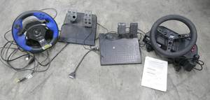 lot 269 image: Racing steering wheels and pedals for computer games