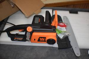 lot 59 image: Electric Chainsaw