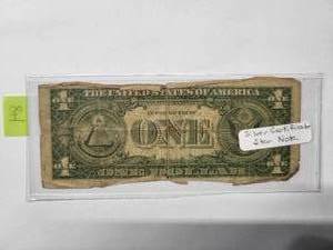 lot 84 image: $1  Blue Seal silver certificate  with star  1957   Good