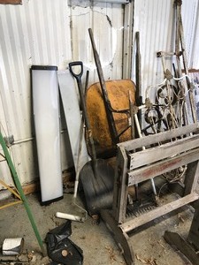 lot 60 image: Wheel barrow, saw horses, vintage iron board, and more