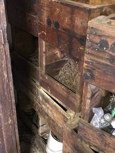 lot 71 image: Wood crates and wood barrel of hardware