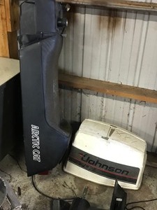 lot 69 image: Johnson boat motor parts, snow blower and more