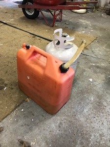 lot 78 image: 20 gal. propane tank and 5 gal gas can