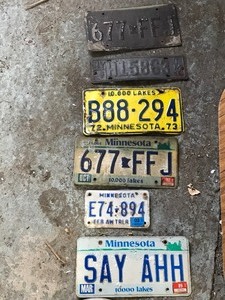 lot 89 image: License plates and hub cap