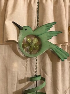 lot 177 image: Windchimes and watering can