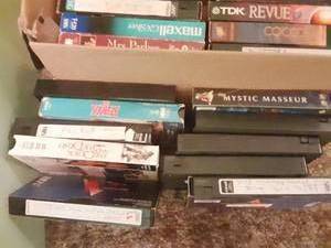 lot 181 image: 2 boxes and a bag of VHS tapes