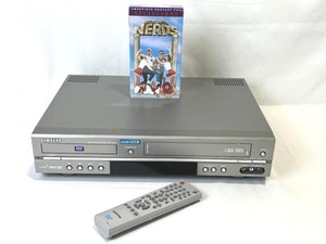 lot 38 image: Samsung DVDVHS Combo Player (Model V2000) with Remote & New Sealed Revenge of the Nerds VHS
