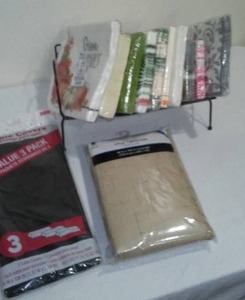 lot 615 image: Varity Of Napkins And Tablecloths, - All New In Package.
