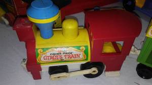 lot 658 image: Fisher Price Trains - Circus, Huffy - Puffy and more in a tote.