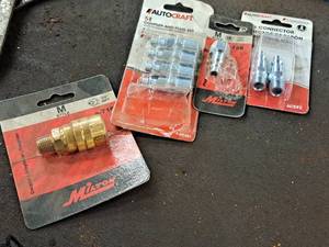 lot 876 image: Lot of (4) Air Coupler Attachments (in original packaging)