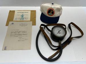 lot 86 image: Vintage Misc. Military Items Including Flight Deck Pressure Gauge, USS LITTLE ROCK Snapback Hat & More