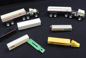TOY SEMI TRUCK  TRACTORS AND A VARIETY OF TRAILERS