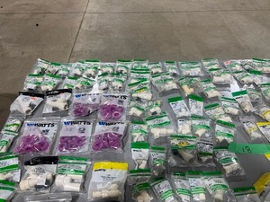 lot 18 image: TABLE FULL OF PEX CONNECTIONS, VALVES, & PVC FITTINGS