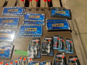 lot 62 image: 10 PAIRS LICENSE PLATE FRAMES, 2 COMPASS, 13 DOOR LOCK KNOBS, 4 SHIFT KNOBS, 3 CIGARETTE LIGHTER, 7 AIR PURIFIER, & 6 PARKING MARKERS