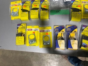 lot 55 image: TABLE FULL OF 4,5,6,7 WAY CONNECTOR MOUNTING BRACKETS, 6 WAY RD W4 WAY FLAT 48, 12 VOLT ADAPTERS