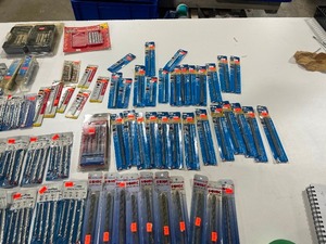 lot 10 image: TABLE FULL OF MASONRY BITS VARIOUS SIZES AND BRANDS $240 RETAIL VALUE