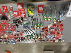 lot 70 image: TABLE FULL OF VARIOUS PLUMBING PARTS