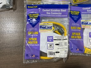 lot 74 image: 11 COATED STAINLESS STEEL GAS CONNECTORS