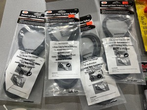 lot 153 image: MOSSY OAK HEAD PHONES, SHOOTERS AID, BUTT OUT 2, 4) SHOE TRACTION SPIKES, AND HUNTERS UMBRELLA