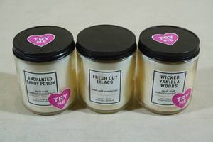 lot 134 image: 3 Bath & Body Works Candles -Enchanted Candy Potion, Fresh Cut Lilac, Wicked Vanilla Woods